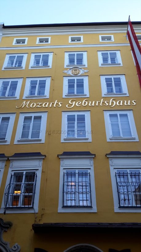 Salzburg 101 - stopping for a few moments in front of Mozart's Birthhouse, at Getreidegasse 9, on a 27 January at noon