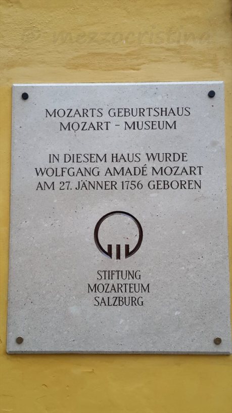 Salzburg 104 - stopping for a few moments in front of Mozart's Birthhouse, at Getreidegasse 9, on a 27 January at noon